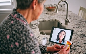 Patient using HIPAA secure telemedicine in NextGen Office 